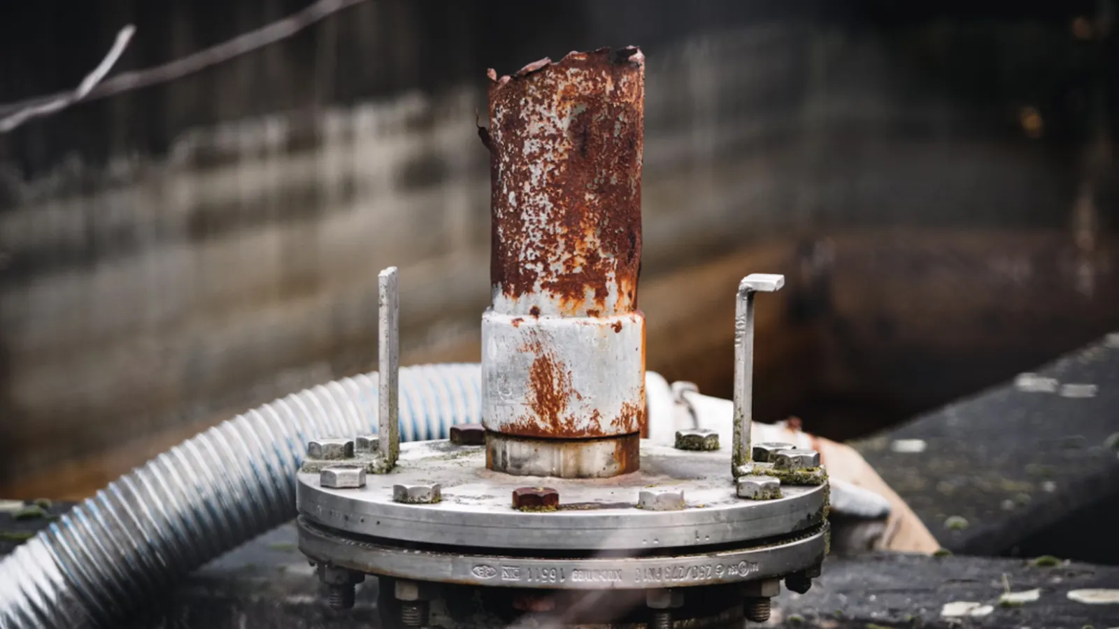 Corroded gas pipe fitting showing signs of leak risk